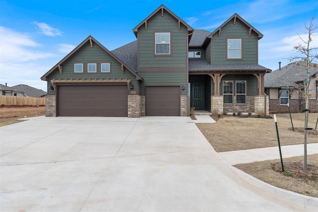 729 Caladium Dr, Yukon, OK 73099 - craftsman-style home with fence, driveway, covered porch, a shingled roof, and a garage