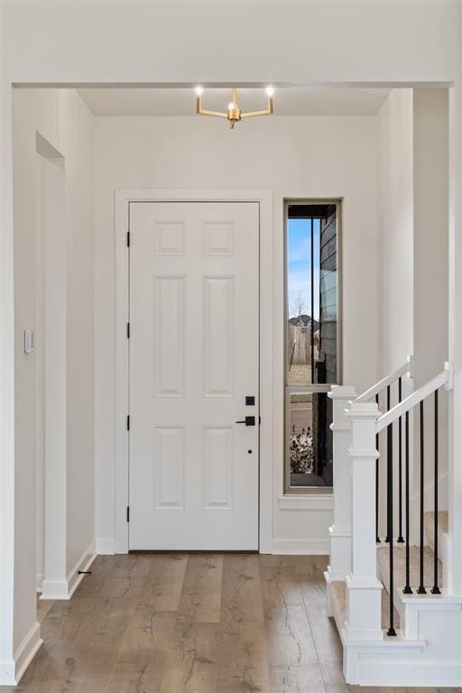 729 Caladium Dr, Yukon, OK 73099 - foyer entrance featuring wood finished floors and baseboards