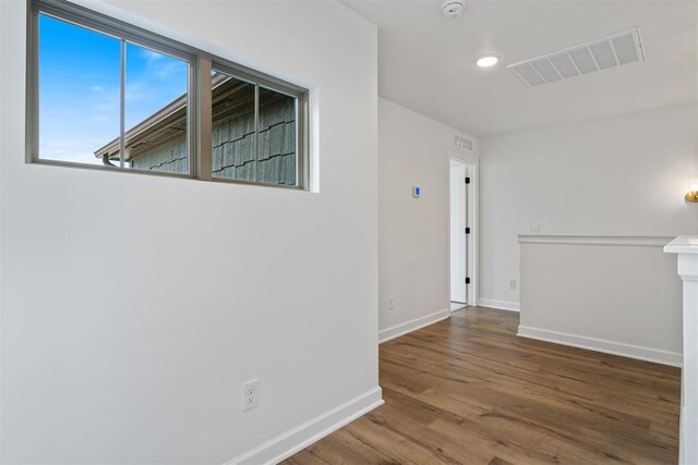 729 Caladium Dr, Yukon, OK 73099 - unfurnished room featuring visible vents, baseboards, and wood finished floors