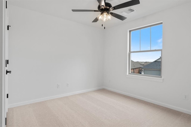 729 Caladium Dr, Yukon, OK 73099 - carpeted spare room with visible vents, a ceiling fan, and baseboards