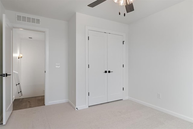 729 Caladium Dr, Yukon, OK 73099 - unfurnished bedroom with baseboards, visible vents, carpet floors, and a closet