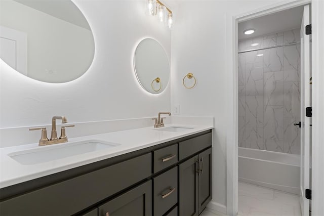 729 Caladium Dr, Yukon, OK 73099 - full bathroom featuring a sink, shower / bath combination, marble finish floor, and double vanity