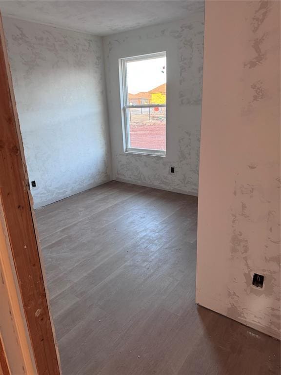 spare room with dark hardwood / wood-style floors