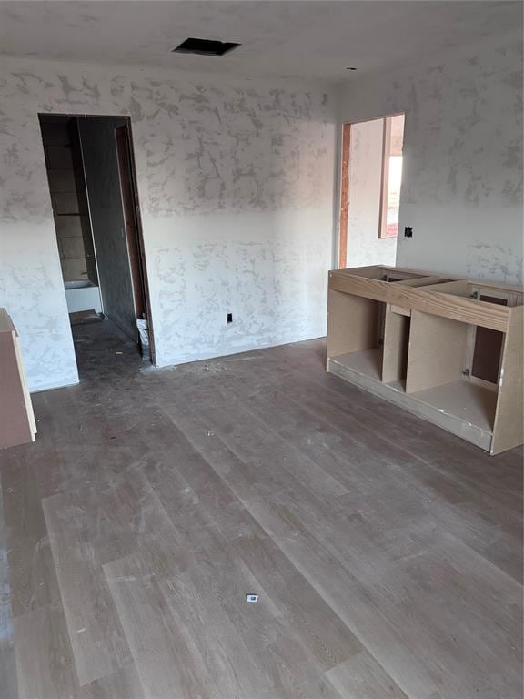 unfurnished room with hardwood / wood-style floors