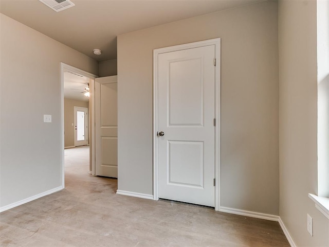 unfurnished bedroom with visible vents and baseboards