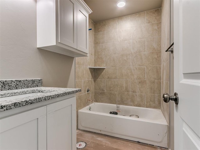 full bathroom featuring shower / bathing tub combination, wood finished floors, and vanity