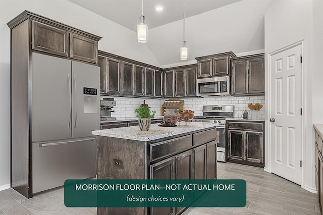 kitchen featuring dark brown cabinets, lofted ceiling, stainless steel appliances, and hanging light fixtures