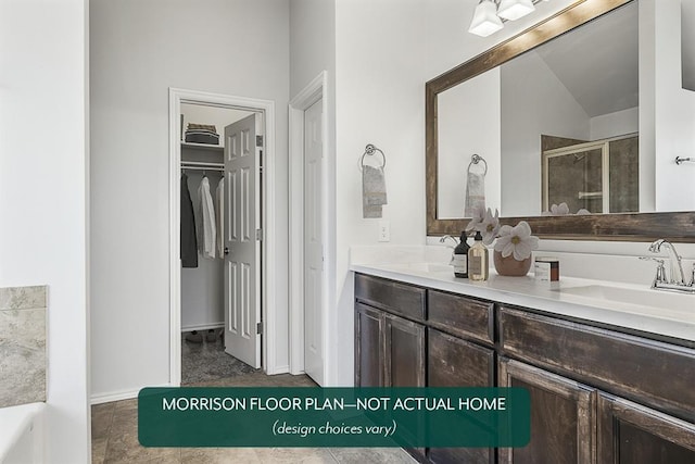 bathroom featuring vanity, a shower with shower door, and vaulted ceiling