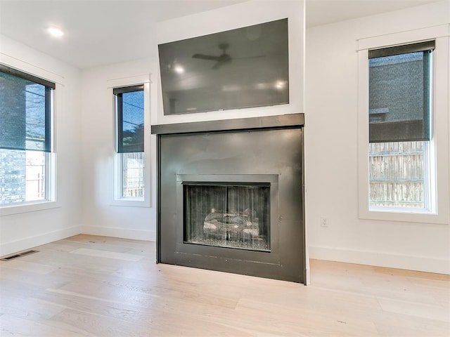 913 NW 43rd St, Oklahoma City, OK 73118 - detailed view of wood finished floors and a fireplace
