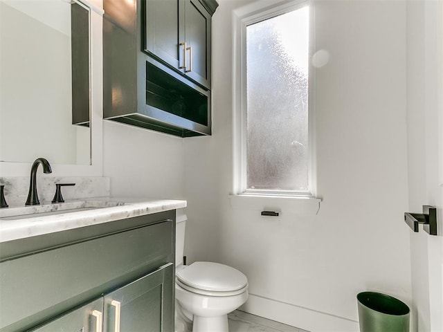 913 NW 43rd St, Oklahoma City, OK 73118 - half bath with marble look tiles, vanity, and plenty of natural light