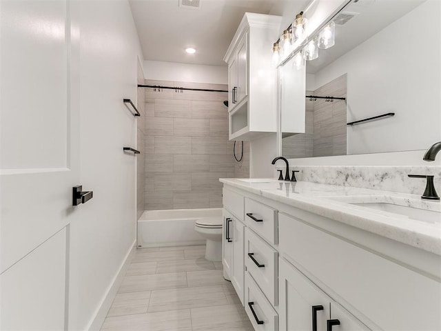913 NW 43rd St, Oklahoma City, OK 73118 - bathroom with double vanity, shower / bathtub combination, marble finish floors, and recessed lighting