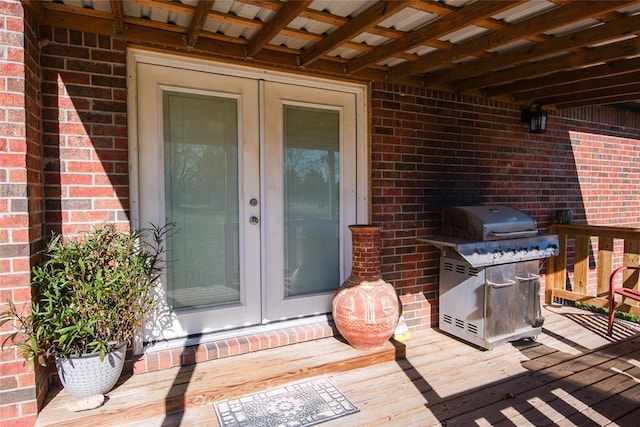 entrance to property featuring a deck and french doors