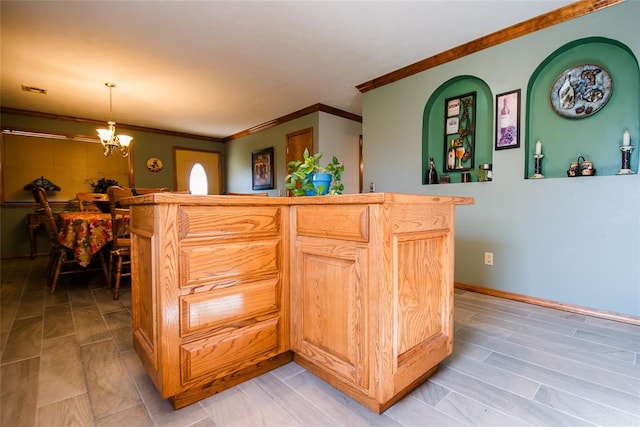 interior space with crown molding, light brown cabinets, decorative light fixtures, and a notable chandelier