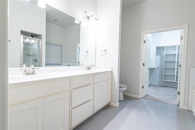 bathroom with vanity, an enclosed shower, tile patterned floors, and toilet