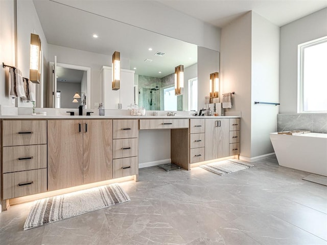 bathroom with vanity and shower with separate bathtub