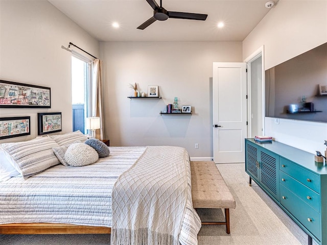 bedroom with light carpet and ceiling fan