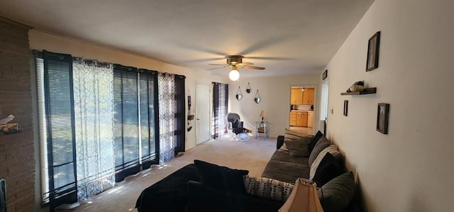 living room featuring light colored carpet and ceiling fan