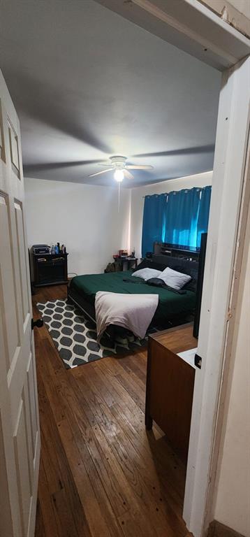 bedroom featuring ceiling fan and hardwood / wood-style floors