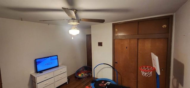 unfurnished bedroom featuring ceiling fan and dark hardwood / wood-style floors