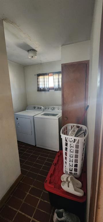 clothes washing area with washing machine and clothes dryer