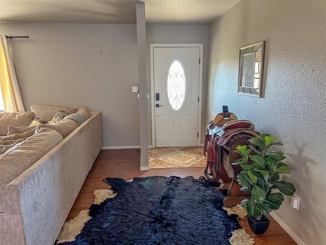 entrance foyer featuring a textured ceiling