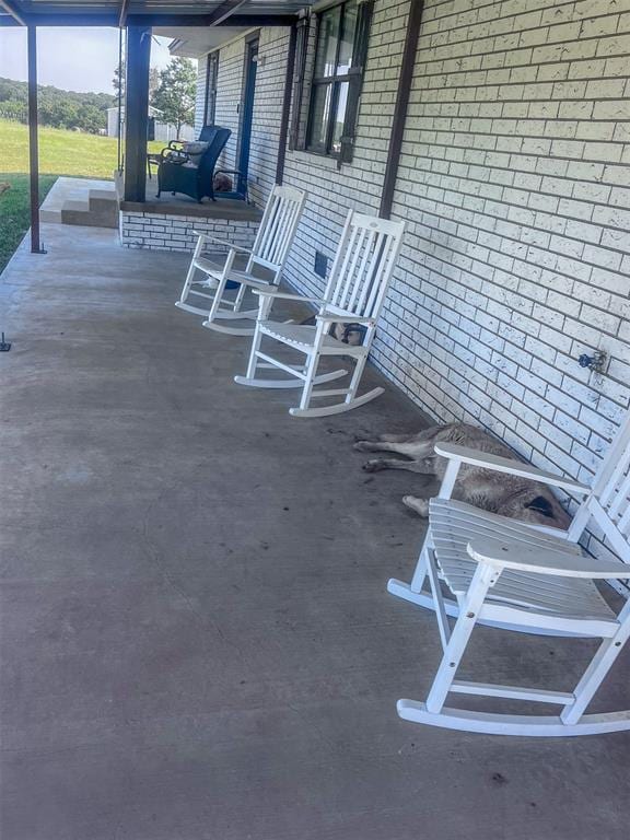 view of patio featuring a porch