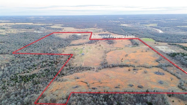 birds eye view of property featuring a rural view