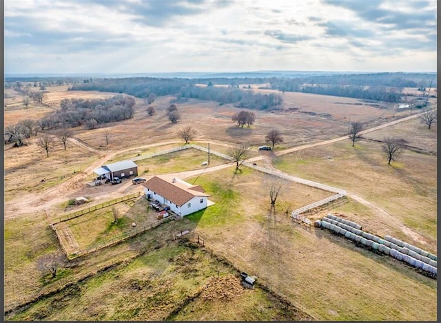 birds eye view of property featuring a rural view