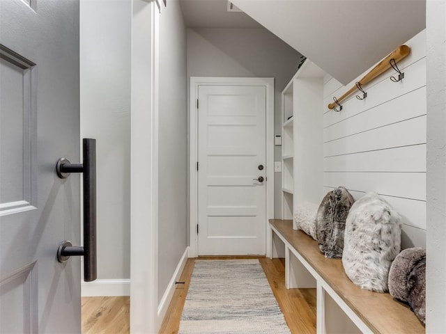 mudroom with light hardwood / wood-style floors