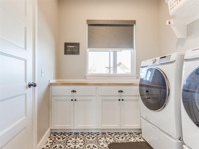 laundry area featuring separate washer and dryer, light tile patterned floors, and cabinets