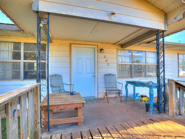 property entrance with a deck