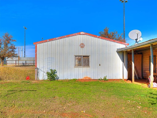 view of outbuilding with a lawn