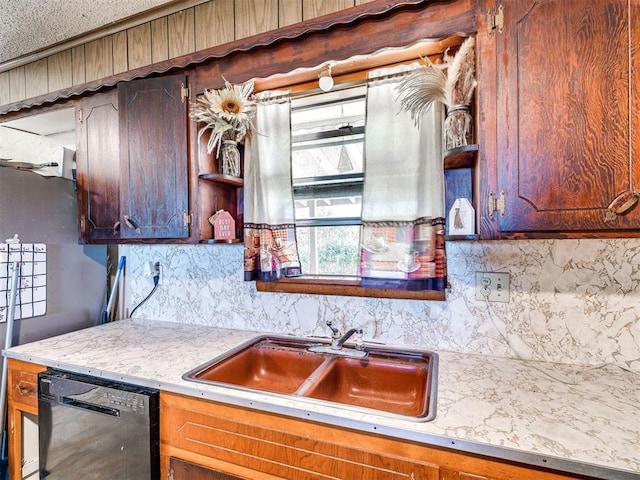 kitchen with tasteful backsplash, dishwasher, and sink