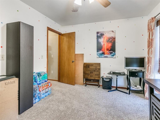 rec room with ceiling fan and light carpet