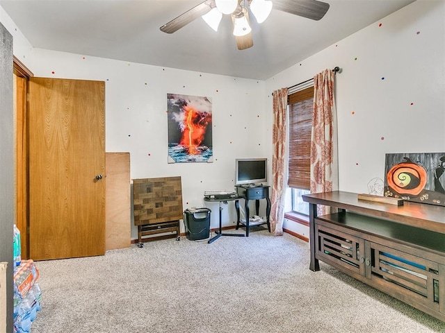 miscellaneous room featuring light carpet and ceiling fan