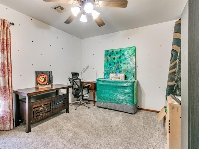 home office featuring ceiling fan and light colored carpet