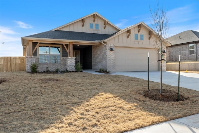 craftsman-style home featuring a garage, brick siding, fence, concrete driveway, and board and batten siding