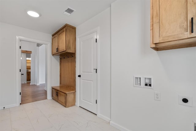 mudroom featuring marble finish floor, visible vents, and baseboards