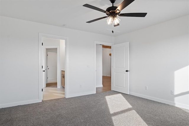 unfurnished bedroom with ceiling fan, baseboards, and light colored carpet