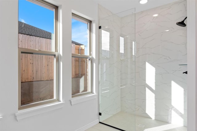 full bath featuring marble finish floor, a marble finish shower, and recessed lighting