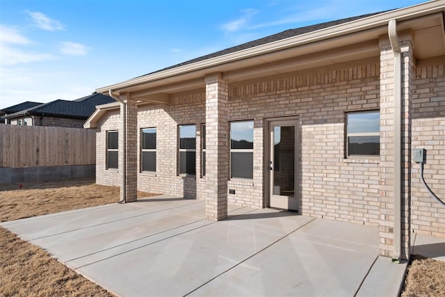 view of patio / terrace featuring fence