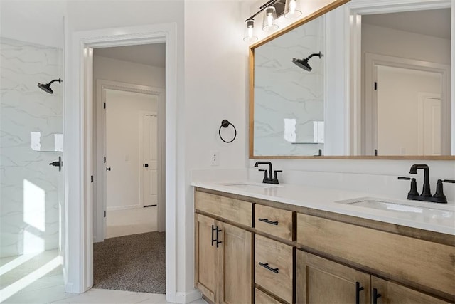 full bathroom featuring double vanity, walk in shower, and a sink