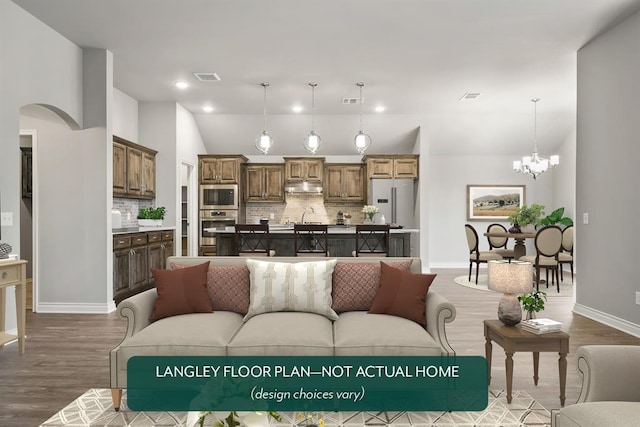 living room featuring wood-type flooring, sink, and an inviting chandelier