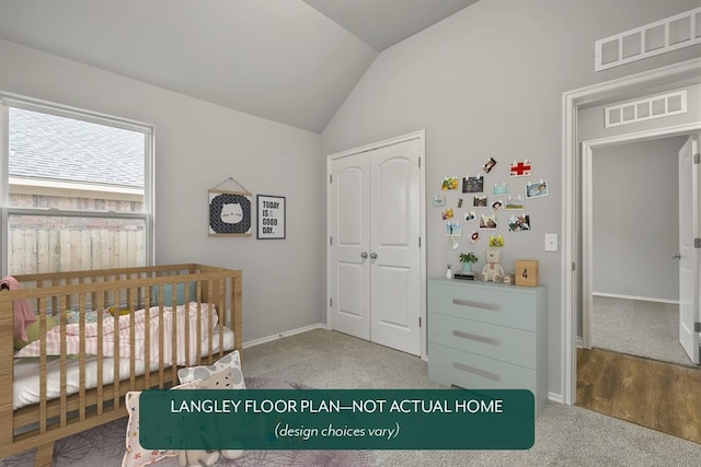 bedroom with carpet flooring, a nursery area, and vaulted ceiling