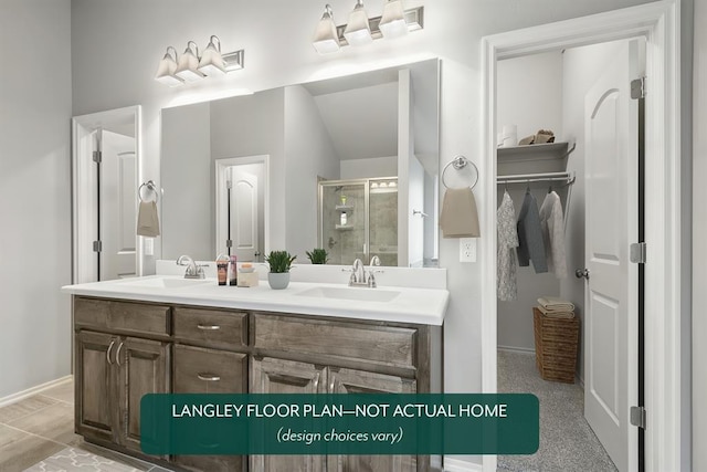 bathroom with vanity and a shower with shower door