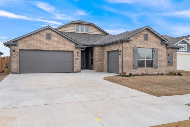 view of front of property with brick siding, an attached garage, driveway, and roof with shingles