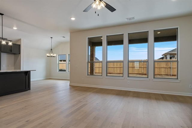 804 Argos Rd, Yukon, OK 73099 - unfurnished living room featuring a ceiling fan, light wood finished floors, a chandelier, recessed lighting, and vaulted ceiling