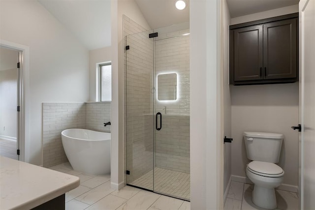 804 Argos Rd, Yukon, OK 73099 - full bathroom featuring a freestanding bath, a stall shower, vaulted ceiling, marble finish floors, and vanity