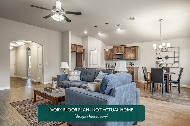 living room featuring light hardwood / wood-style flooring, ceiling fan with notable chandelier, and sink