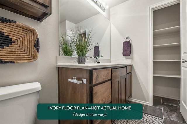 bathroom with vanity and toilet